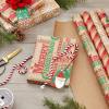 Hallmark Christmas Wrapping Paper Bundle with Cut Lines on Reverse, Kraft (Pack of 4, 88 sq. ft. ttl) Red Trucks, Snowflakes, Stripes, Merry Christmas (5JXW1038)(Red Trucks  Snowflakes  Red Stripes  Merry Christmas)
