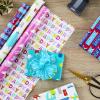 Hallmark Kids Birthday Wrapping Paper (3 Rolls: 75 sq. ft. ttl) Rainbows, Hearts, Flowers on Bright Pink, T-Rex, Dinosaurs, Jungle on Navy Blue, Green, Red, Orange “Happy Birthday” on Yellow(Monsters and Unicorns)