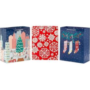 Hallmark 13″ Large Cute Christmas Gift Bags (3 Bags: Pink Stockings on Branch, Paper Snowflakes, Ice Skating in the City) for Kids, Teens, Friends, Teachers(Pink  Gray  Red)